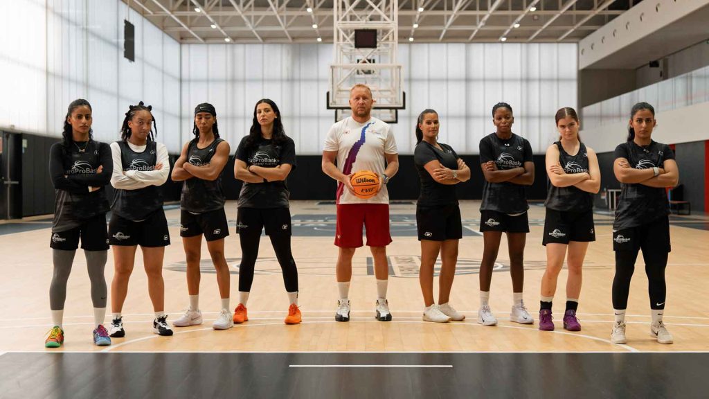 A full group of players and coaches in the EuroProBasket Women's Program, highlighting the professional environment for playing pro basketball overseas as a woman in Spain.
